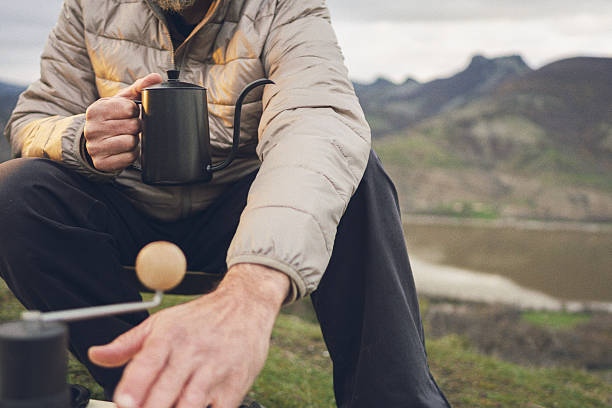 istock Mature Man Camping Enjoying Coffee In Nature 2251920987
