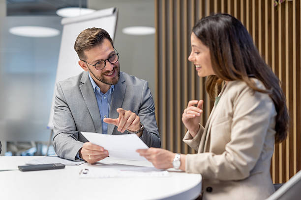 istock Business colleagues discussing documents in modern office 2251921388