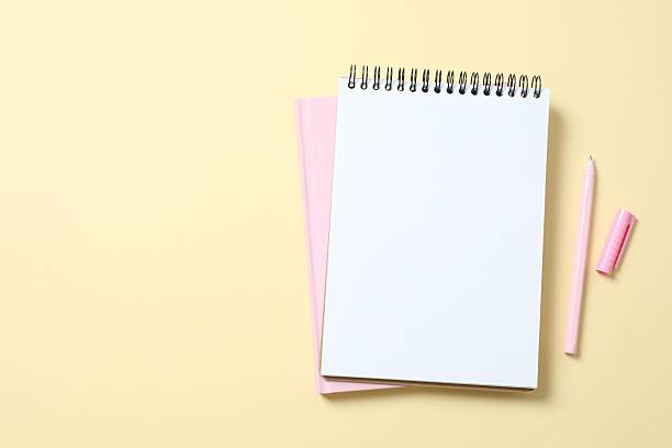 istock Open notebook with pen on color background, top view 2251922281