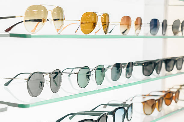 istock Display of various sunglasses in a retail store during daytime showcasing different styles and colors arranged neatly on shelves 2251934164