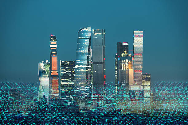 istock Futuristic smart city skyline with glowing digital hexagonal network overlay on blue background illustrating modern IoT cloud technology concept. 2251941281