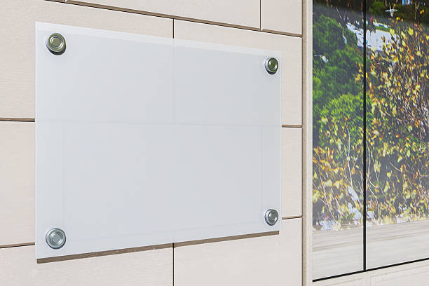 istock Blank vertical signage board mounted on modern building wall exterior with clean background and copyspace for branding or business design display. 3D Rendering 2251941352
