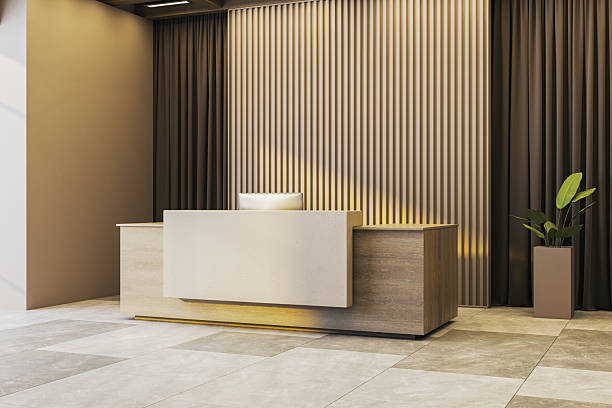 istock Modern reception desk in clean corporate office interior with wood panel wall, tiled floor, and potted plant in empty room space template. 3D Rendering 2251941376