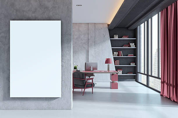 istock Vertical blank canvas mockup on concrete wall in modern corporate office interior with red accents, large windows and city view in background. 3D Rendering 2251941443