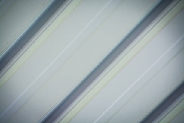 Abstract Metallic Texture of Soft Diagonal Lines: Neutral White and Grey Corrugation Pattern for Technology and Business.