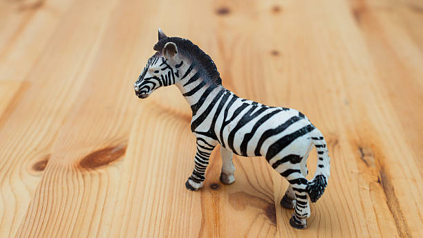 istock Zebra toy figurine wooden surface playful setting close-up view animal concept 2251943018