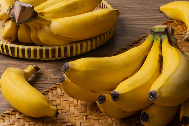 istock Fresh Organic Bananas on Rustic Wood 2251946583