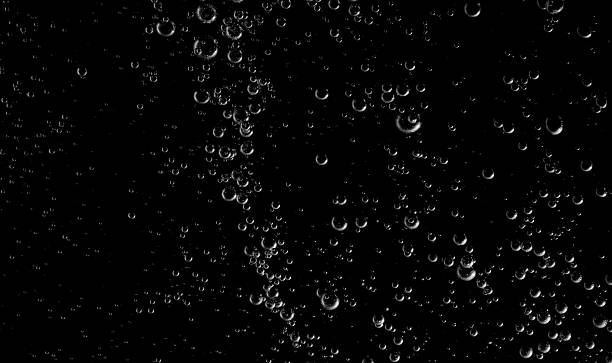 istock Clear water bubbles rising in dark background, abstract underwater texture ideal for design, science, and creative projects. Perfect for backgrounds, overlay, or refreshing clean concept visuals. 2251947880