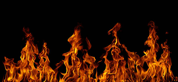 istock Realistic fire flames isolated on black background, burning effect with glowing orange heat. Perfect for overlays, design, visual effects, danger concepts, or dramatic backgrounds. 2251947889