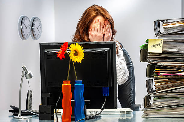 istock Young woman in office working late. 2251949479