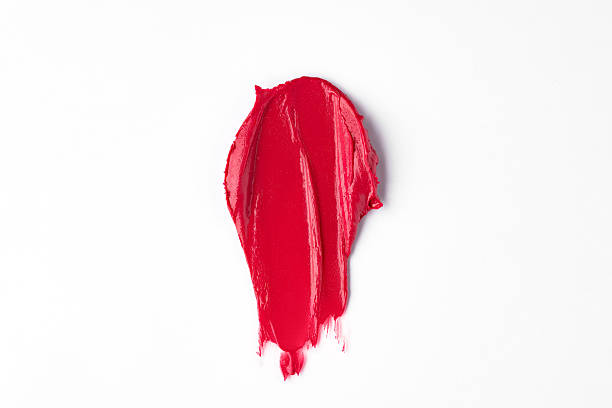 istock Red lipstick swatch smudged texture isolated on white with copy space for background. Beauty concept 2251954294