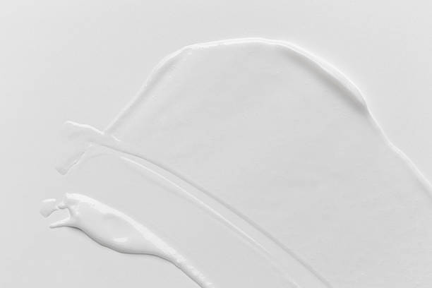 istock Liquid cream cosmetic smudge drops texture on white background. cosmetic smears cream texture 2251954461