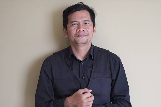 istock Professional Asian man standing confidently, looking at camera 2251956413