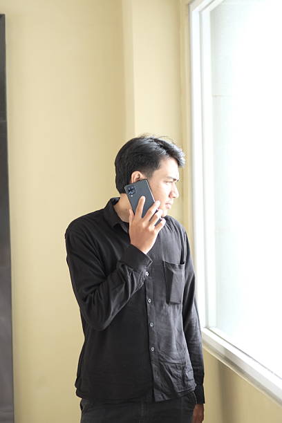 istock Professional young man having a conversation on his mobile phone 2251957301