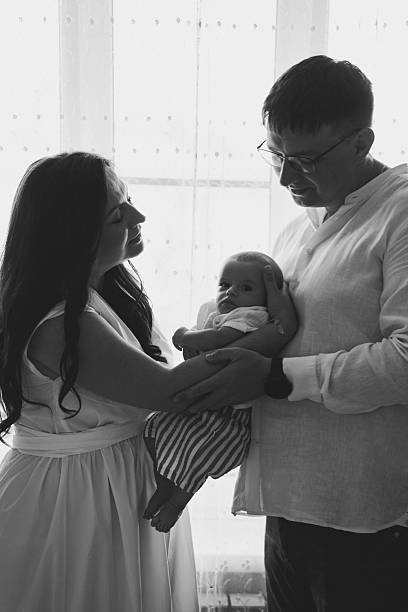 istock New parents share a tender moment with their newborn 2251958040