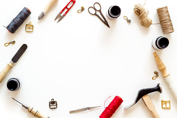 istock Leather crafting tools in tailor or shoemaker shop, top view 2251958414