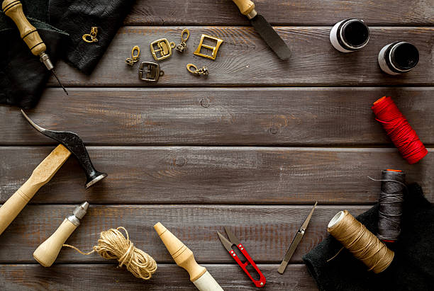 istock Frame flat lay of leather craftsman or shoemaker tools and equipment, top view 2251959049
