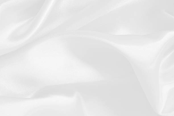 istock White fabric texture for background and design, beautiful pattern of silk or linen. 2251961512