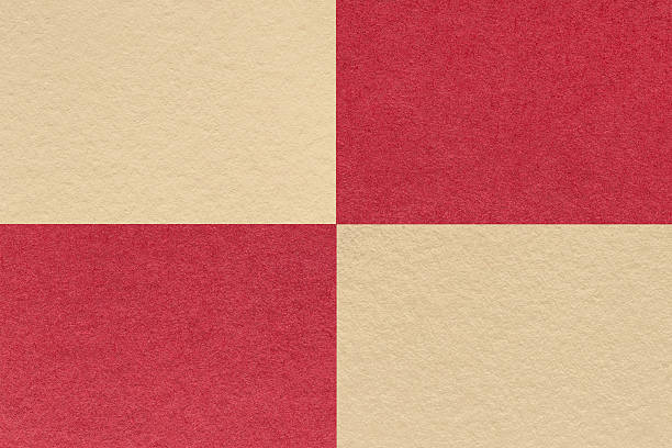 istock Texture craft red and beige paper background with cells pattern. Vintage cardboard with copy space for banner 2251974559