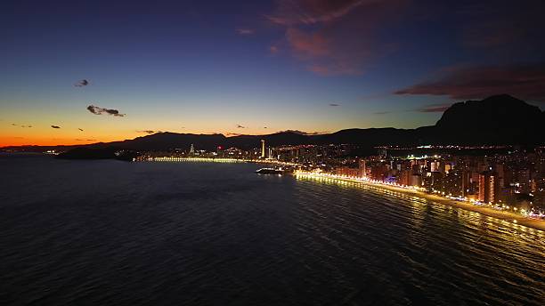 istock Brightly Lit Path Along Shoreline During Sunset Showcasing Stunning Mountain Landscapes For Tourism Promotion 2251977240