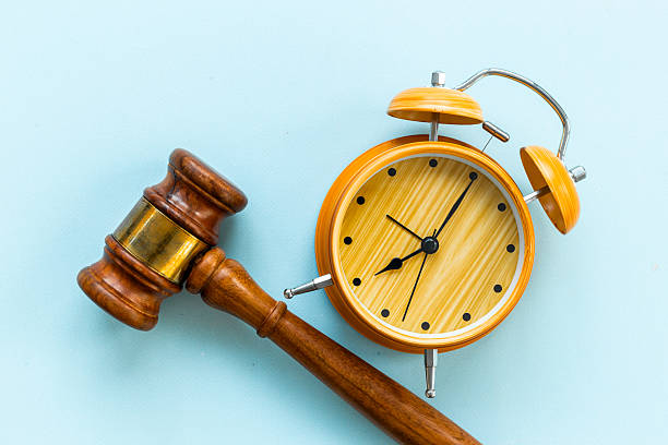 istock Alarm clock judges gavel, top view. Deadline and time management concept 2251977249