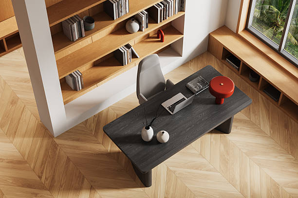 istock Modern home office interior with wood textures, top view of stylish workspace design featuring dark desk, light flooring, and elegant decor elements. 3D Rendering 2251981207