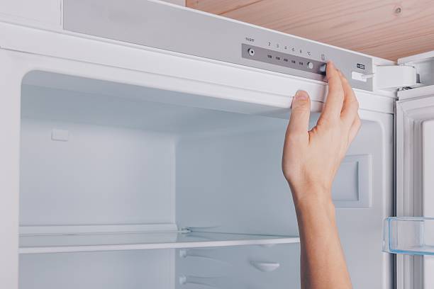 istock Adjusting Temperature Control of a Modern Refrigerator for Optimal Freshness and Energy Efficiency in Kitchen Storage Solutions 2251982443