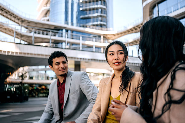 istock Business people talking outdoors in city 2251986700