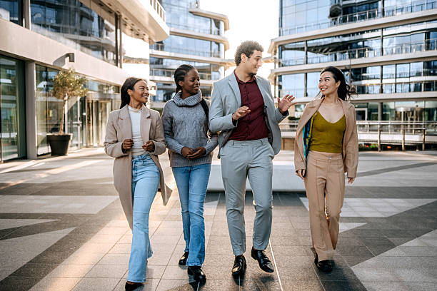istock Colleagues walking and talking in the city 2251986957