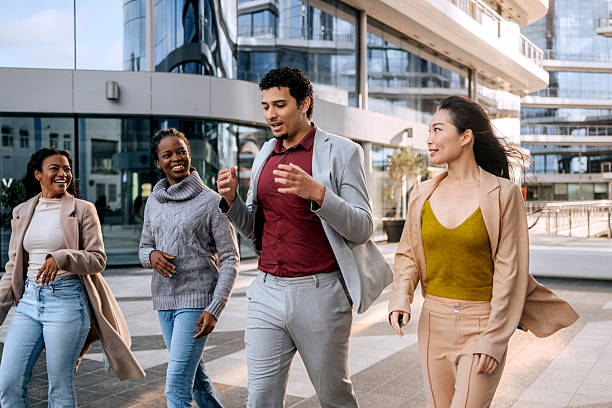 istock Colleagues walking and talking in the city 2251986991
