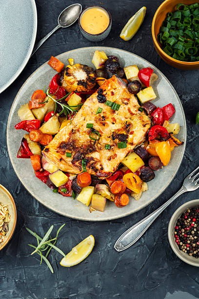 istock Roasted salmon fillet with vegetables. 2251993809