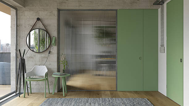 istock Modern interior with concrete wall and ribbed glass partition. Green door design. 3d render 2251995630