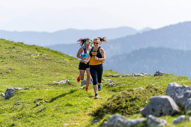 istock Energetic Women Enjoying Trail Run on Scenic Mountain Path 2251995800