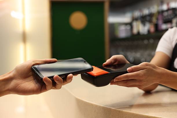 istock Man paying with smartphone via terminal in cafe, closeup 2251997196