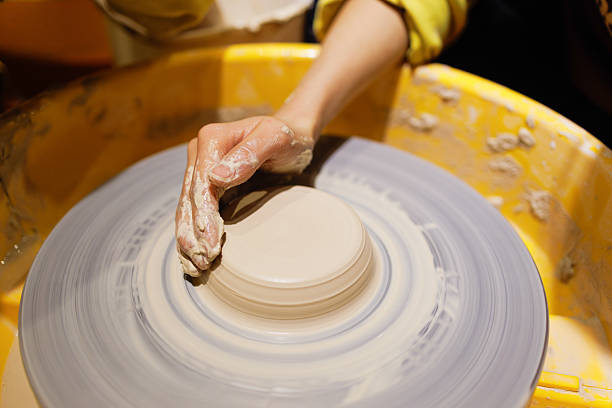Close up shot of hands making pottery