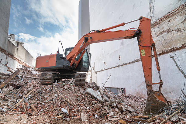 istock Excavator working on a construction site, on a pile of rubble. 2251998081