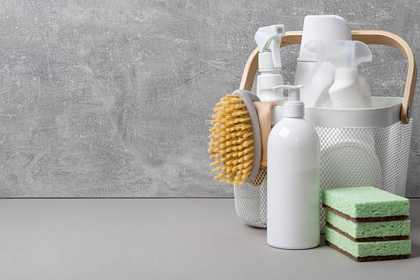 istock Eco-friendly cleaning products and supplies on grey table, space for text 2251999922