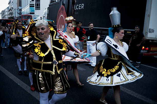 Lisbon, Portugal - June 12, 2025: Men and women dressed in traditional folklore costumes parade in Lisbon downtown during this city celebrations of the Popular Saints.