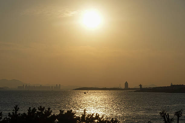 istock Golden Sun Over Water With Distant Boats 2252001854