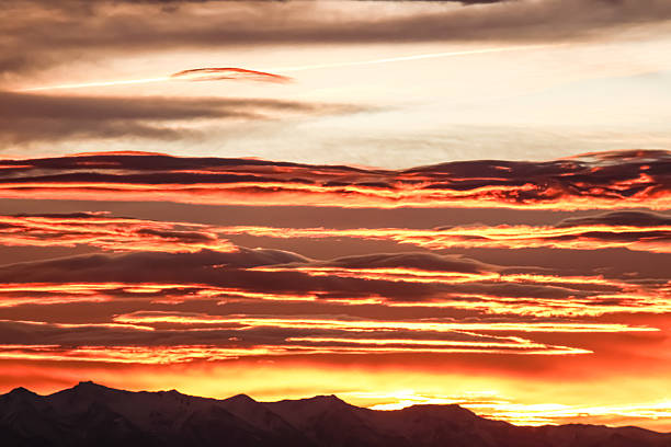 A view of Mount Lougheed, on the left, and The Three Sisters Mountains, on the right, in Canmore, Alberta, Canada, at sunrise.