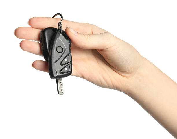 istock Woman with car keys on white background, closeup 2252002406
