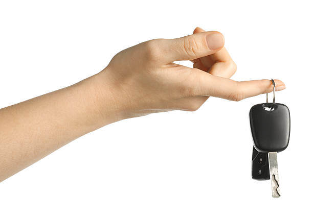 istock Woman with car keys on white background, closeup 2252002787