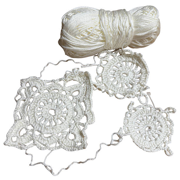 Crochet lace squares with white yarn isolated on white background. Handmade decorative textile elements connected together. Detailed cutout for needlework, craft, and vintage design themes.