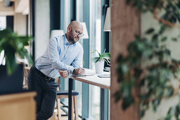 istock Middle age businessman working in a modern environment 2252008788