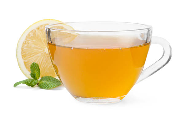 istock Aromatic mint tea with lemon, fresh and dried leaves isolated on white 2252008798