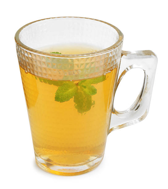 istock Aromatic mint tea and fresh leaves isolated on white 2252008847