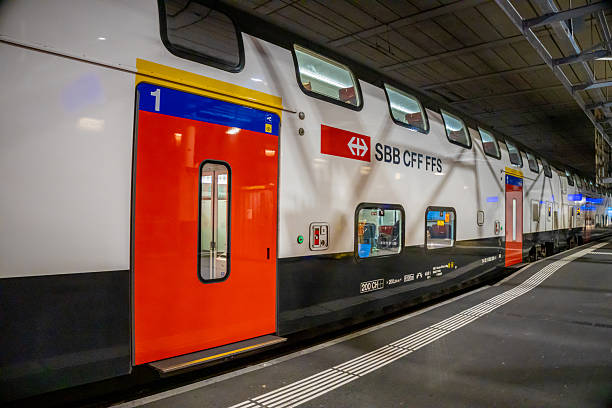 Bern, Switzerland - 11 November 2025: SBB CFF FFS train standing at Swiss railway station platform modern passenger cars urban transport infrastructure transit public rail system Europe operations hubs