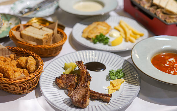Grilled meat collage including new york steak, pork brisket, medium rare beef steak, filet mignon, rack of lamb, pork tenderloin, cowboy rib eye steak and beef fillet chateau