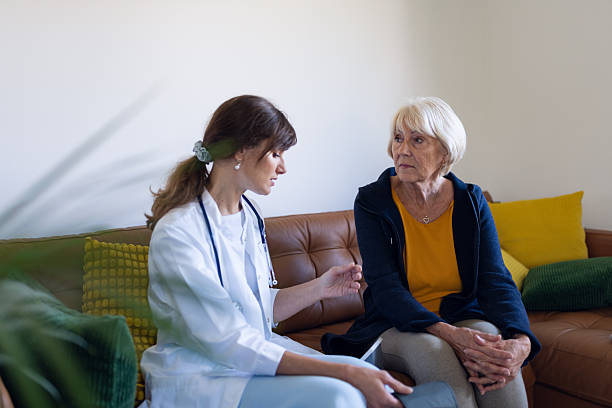 istock Female Doctor Visiting A Patient At Home 2252011510