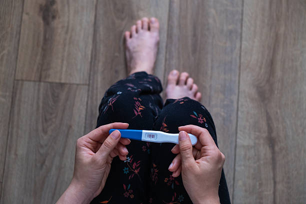 istock Positive Pregnancy Test in Hand 2252012395